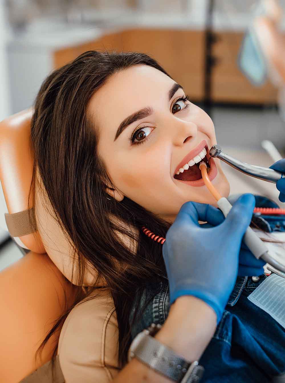 young female patient visiting dentist office